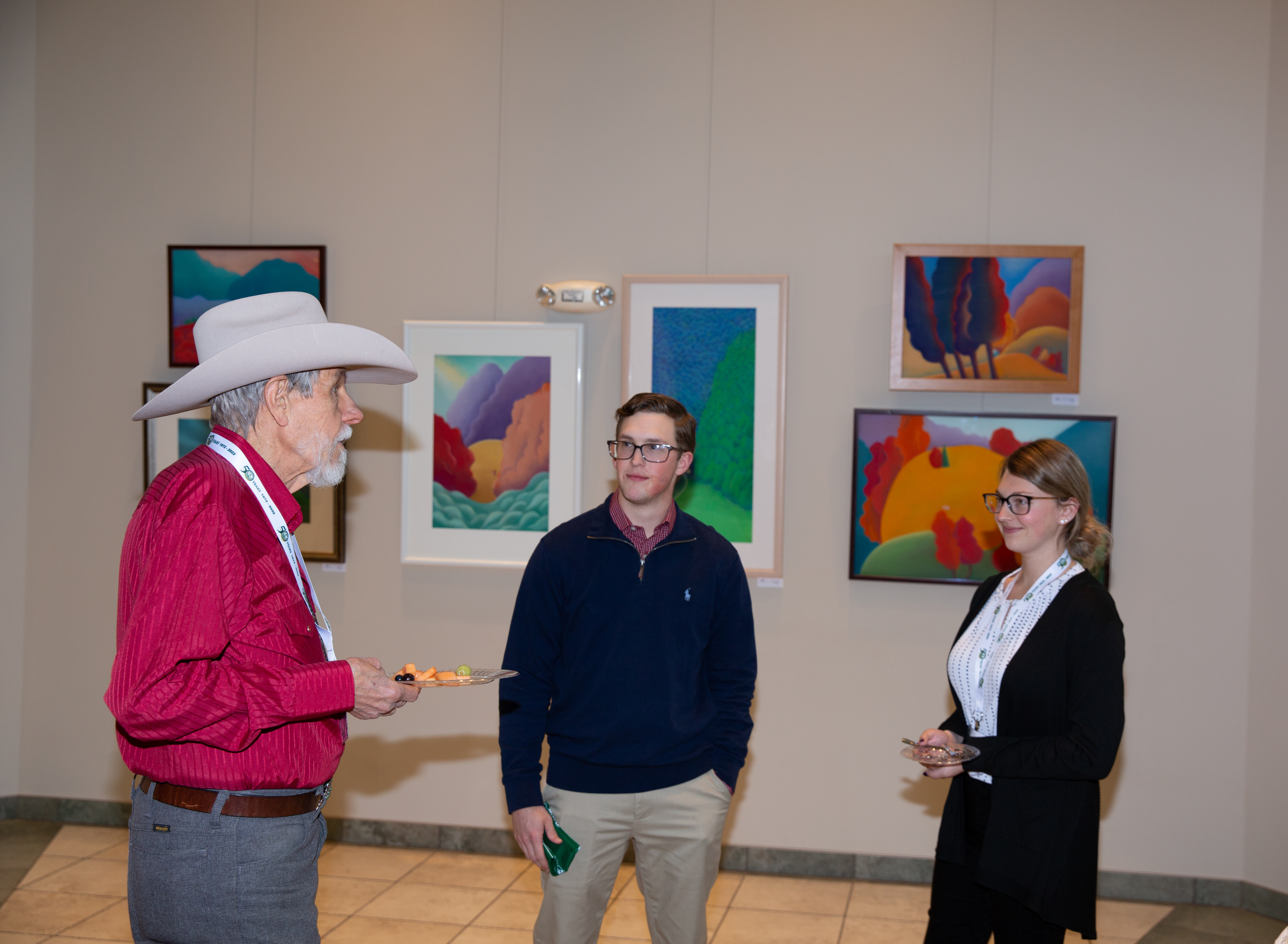 Dr. Foster speaking with other SWC event attendees