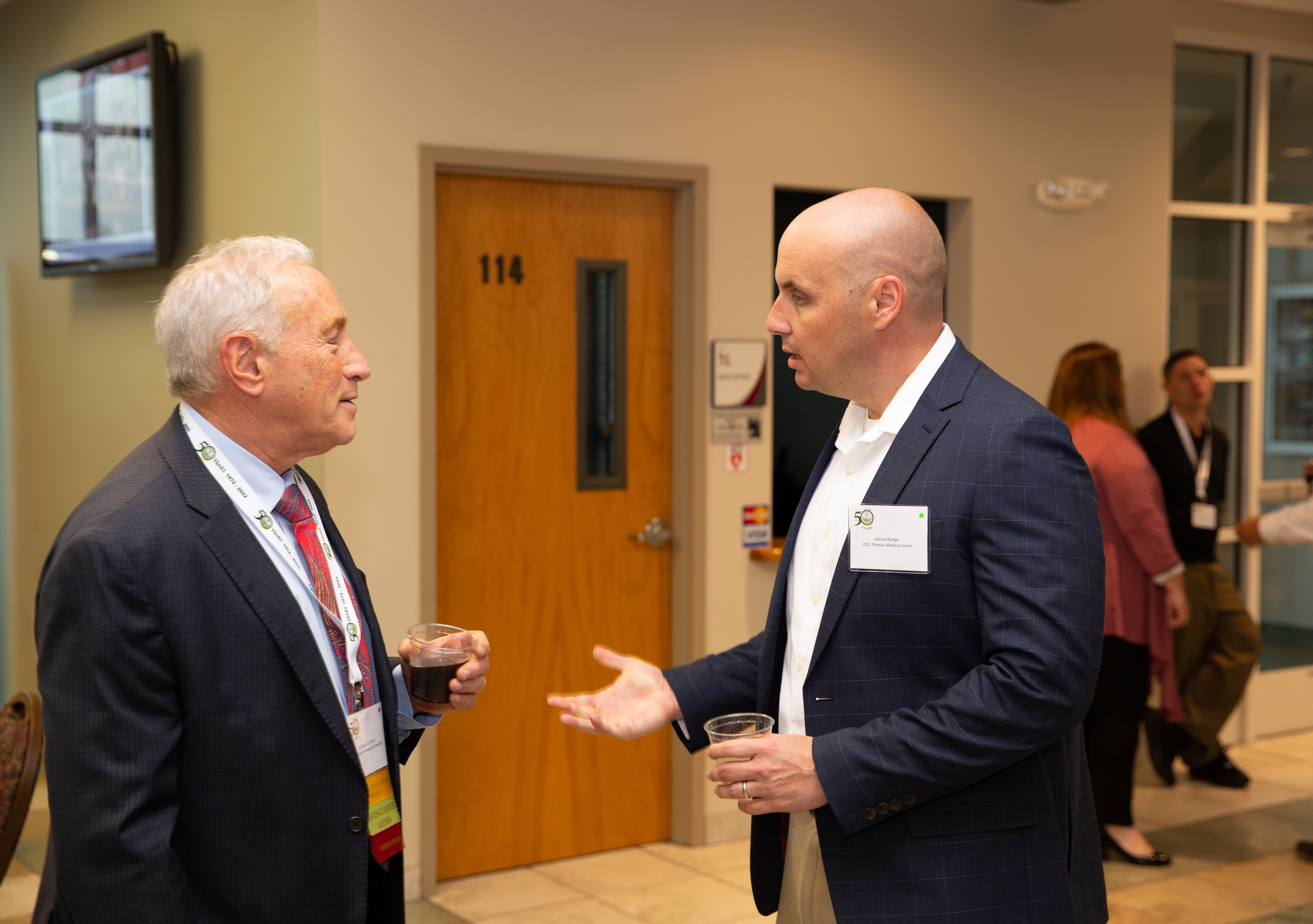 Dr. Rubin speaking with PMC CEO Joshua Wedge