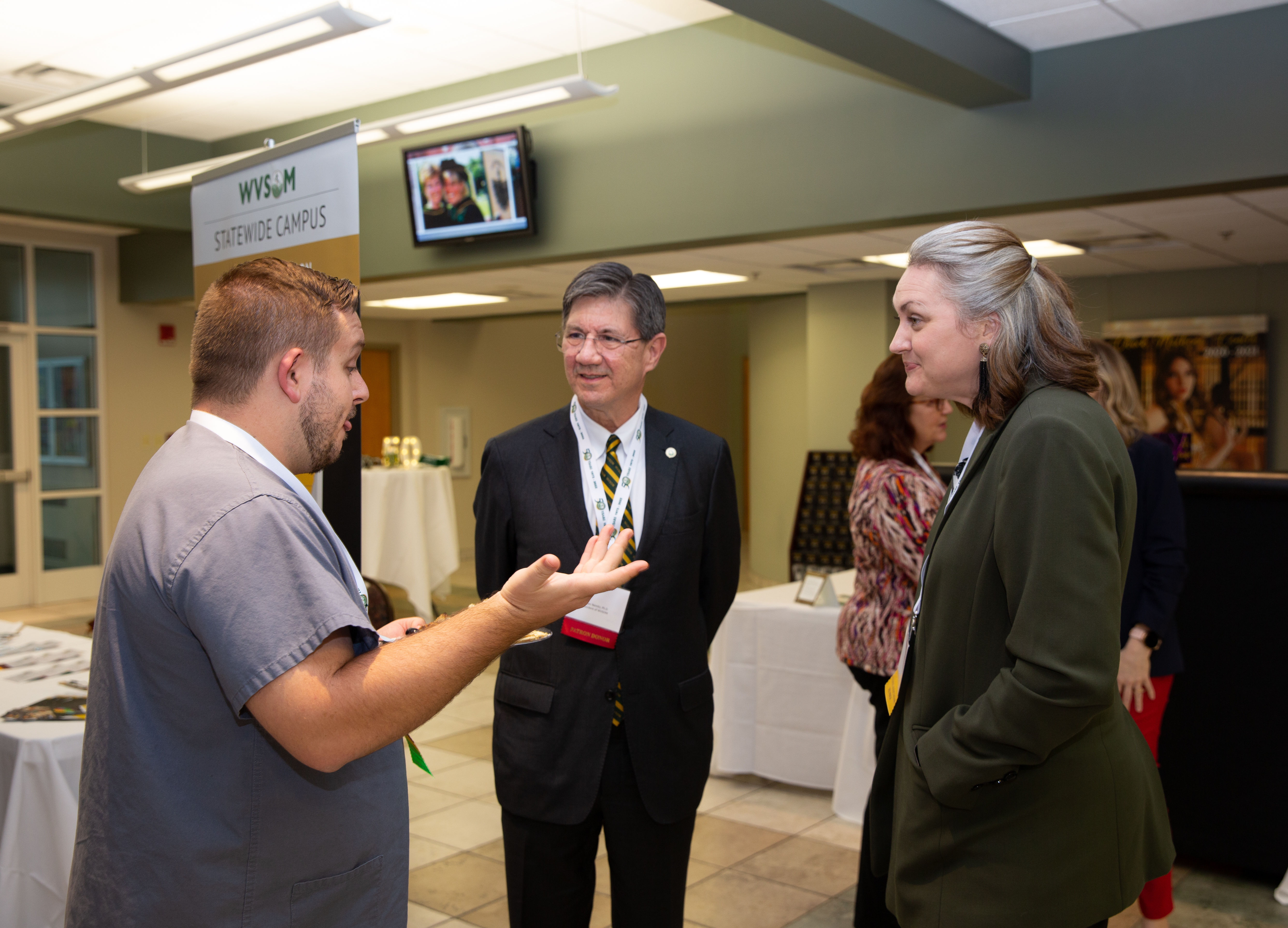 Dr. Nemits president speaking with swc guests and staff