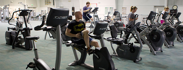 Founder's Activity Center students on workout equipment