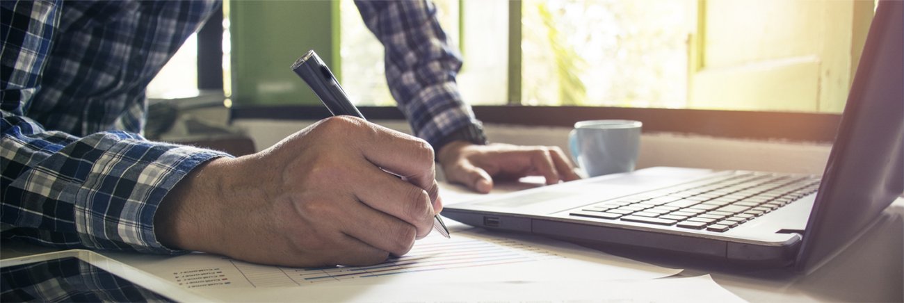 Technology banner with laptop and writing