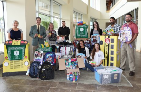 students and staff stuff the bus