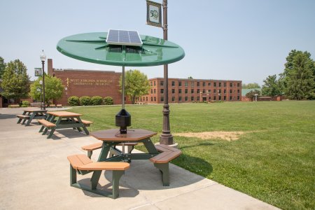 Solar units attached to picnic tables are part of a plan to promote sustainability on WVSOM's campus.