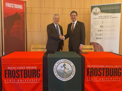 Frostburg State University President Ronald Nowaczyk, Ph.D., shakes hands with WVSOM President James W. Nemitz, Ph.D.
