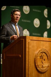 James W. Nemitz, Ph.D., behind a lecturn