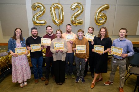 Group of students holding "I matched" signs