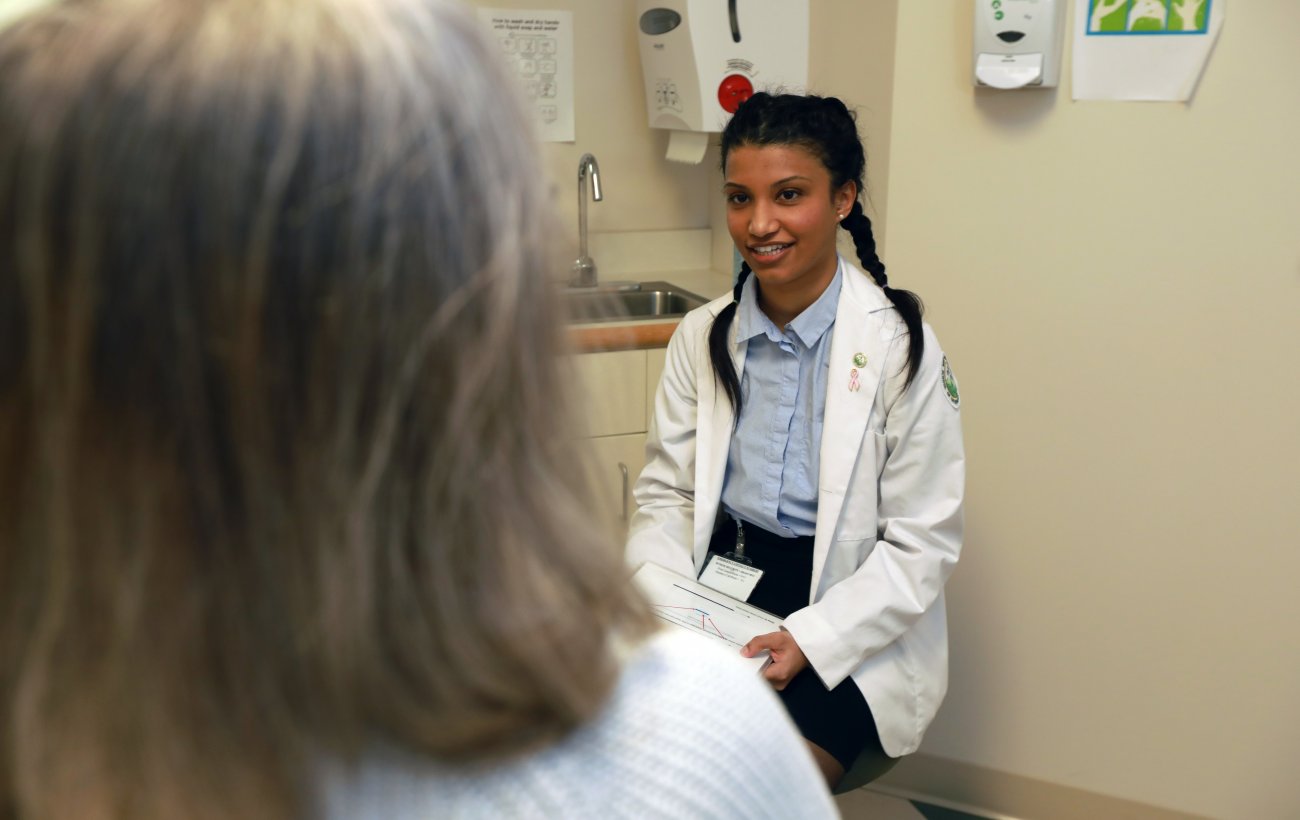 D.O. student talking with a patient