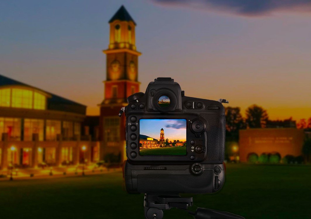 Camera capturing student center alumni tower, showing alumni tower in camera window and background.