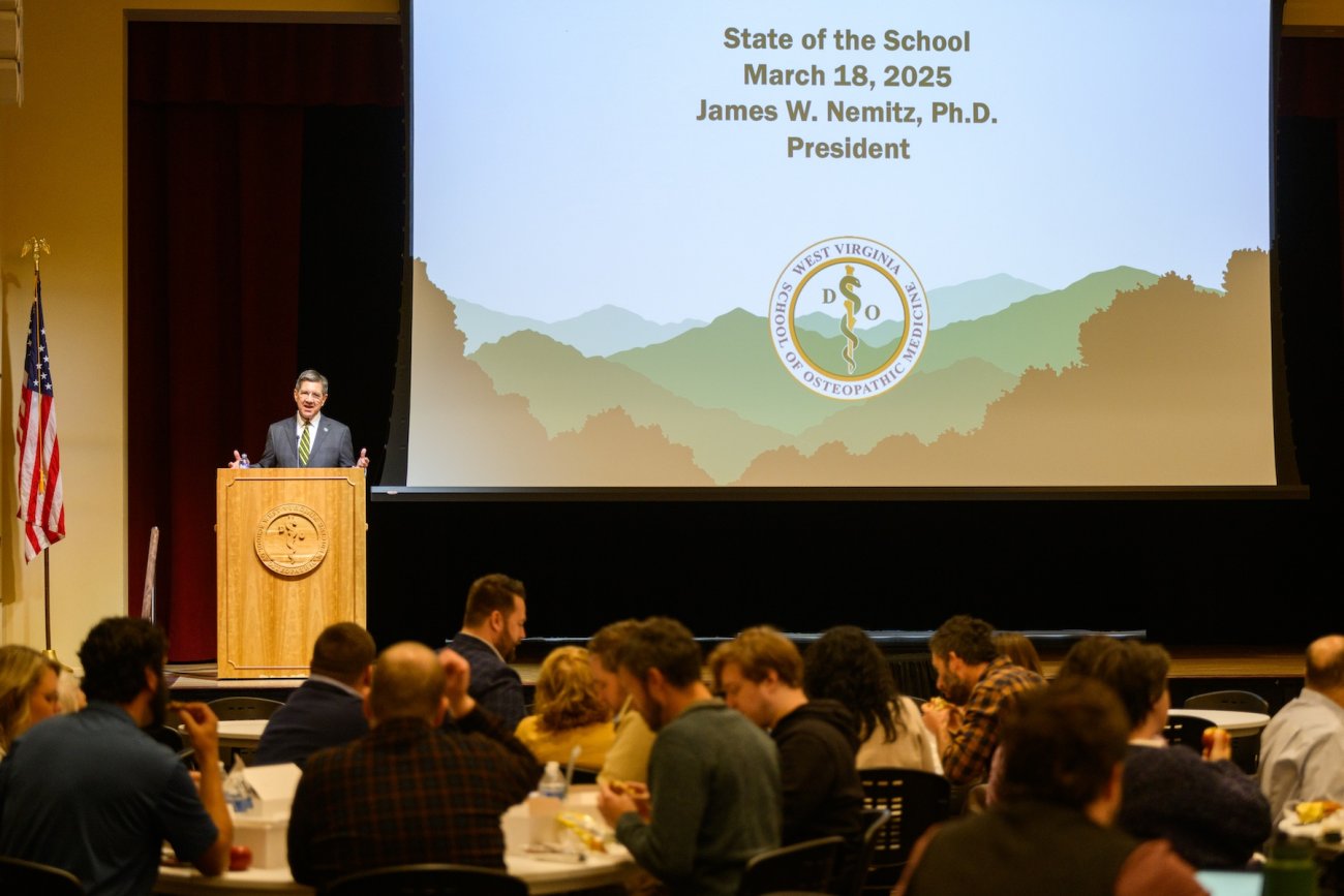James W. Nemitz, Ph.D., speaks to an audience made up of members of the WVSOM community