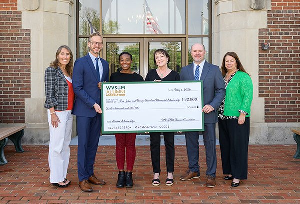 People holding a large check